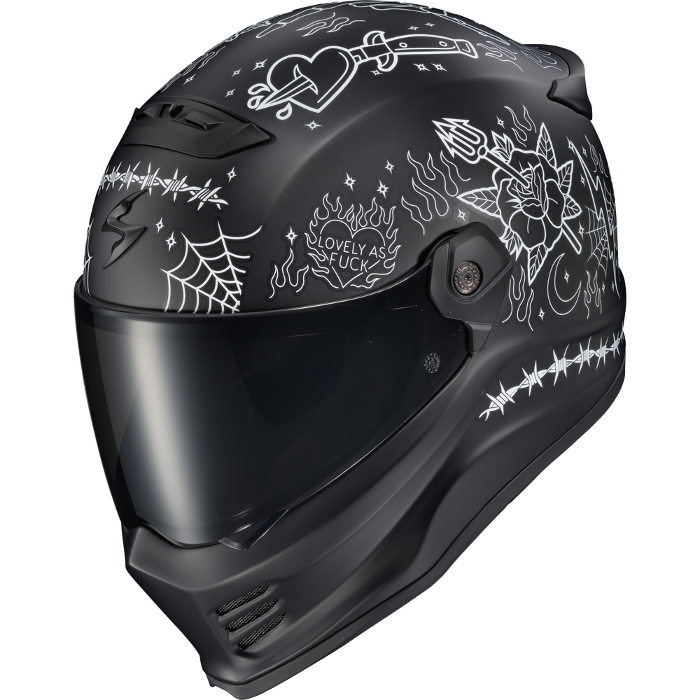 A black full-face motorcycle helmet with white line-art doodles and text, including the phrase 'LOVELY AS A FUCK' on the side, shown against a plain white background.