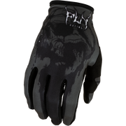 A black and dark gray motocross glove with a subtle skull pattern on the back, featuring a white and black Fox Racing logo on the cuff, set against a plain white background.
