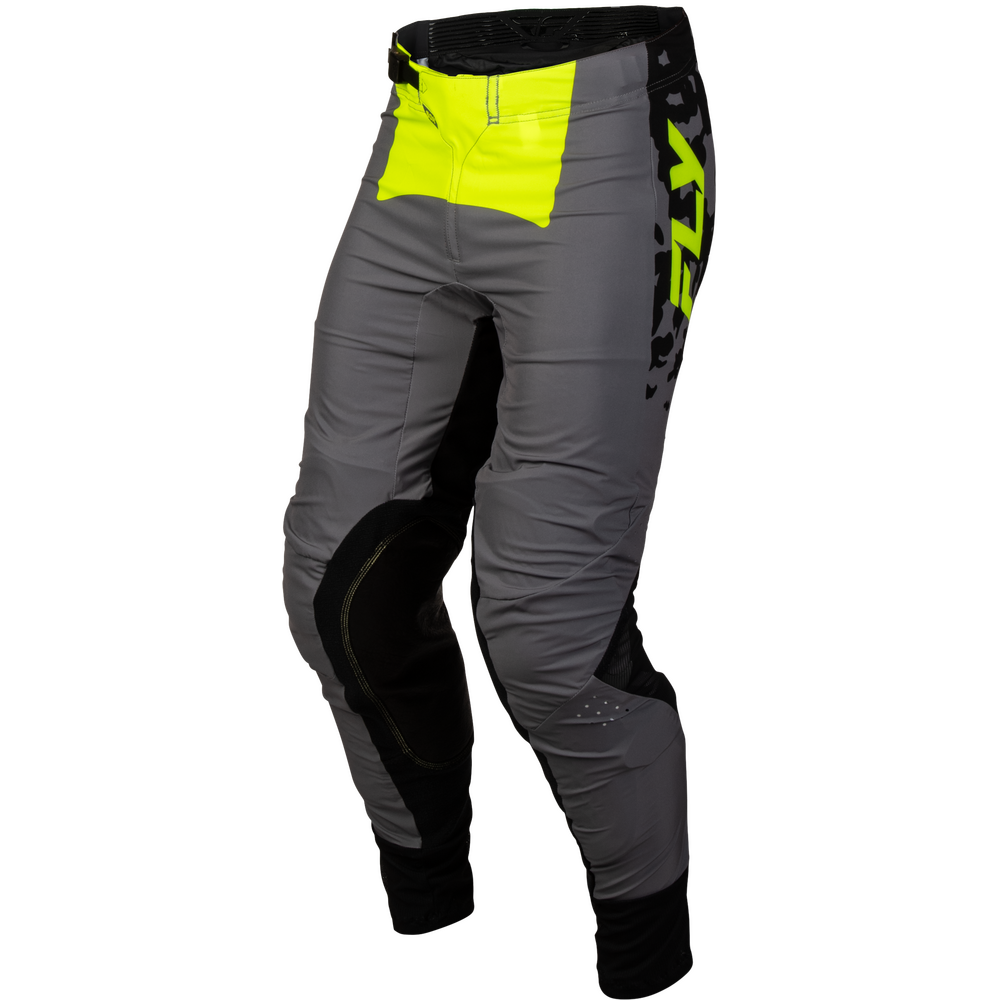 Gray motocross pants with black knee and cuff panels, a bright neon yellow pocket on the right hip, and a vertical black FXR logo on the left leg, shown on a white background.