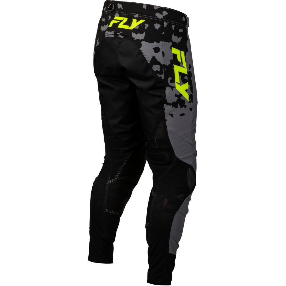 Black and gray motocross pants with a neon yellow FXR logo on the back and side, shown from a three-quarters angle on a white background.