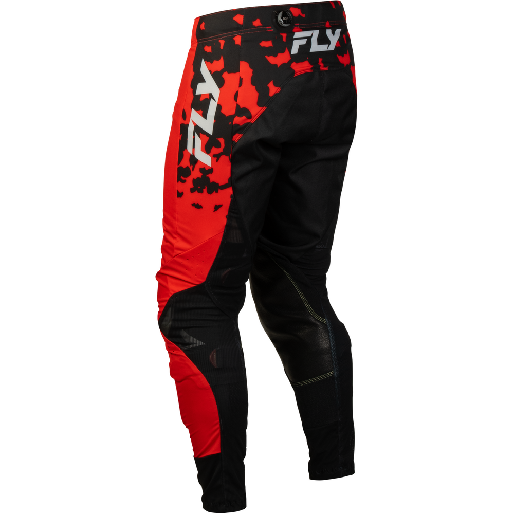 Black and red Fly motocross pants with a red camouflage pattern and white FLY logos on the upper thigh, shown against a plain white background.