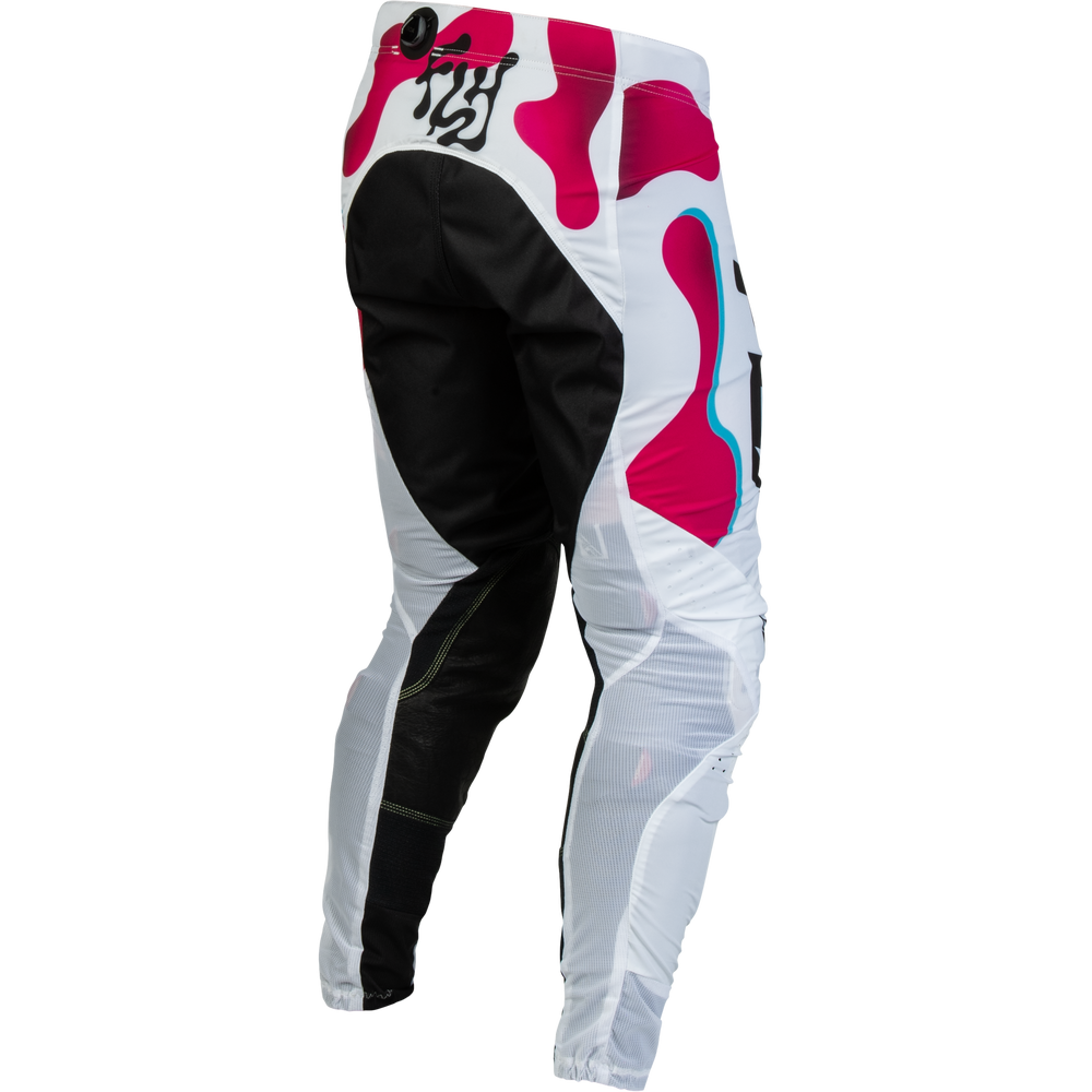 White, black, and pink motocross pants with a black stylized logo on the upper left thigh, shown from a three-quarters angle on a white background.