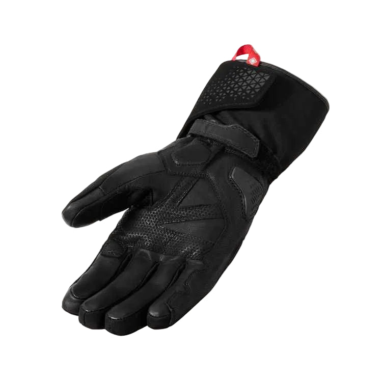 Black glove with red button on a light gray background