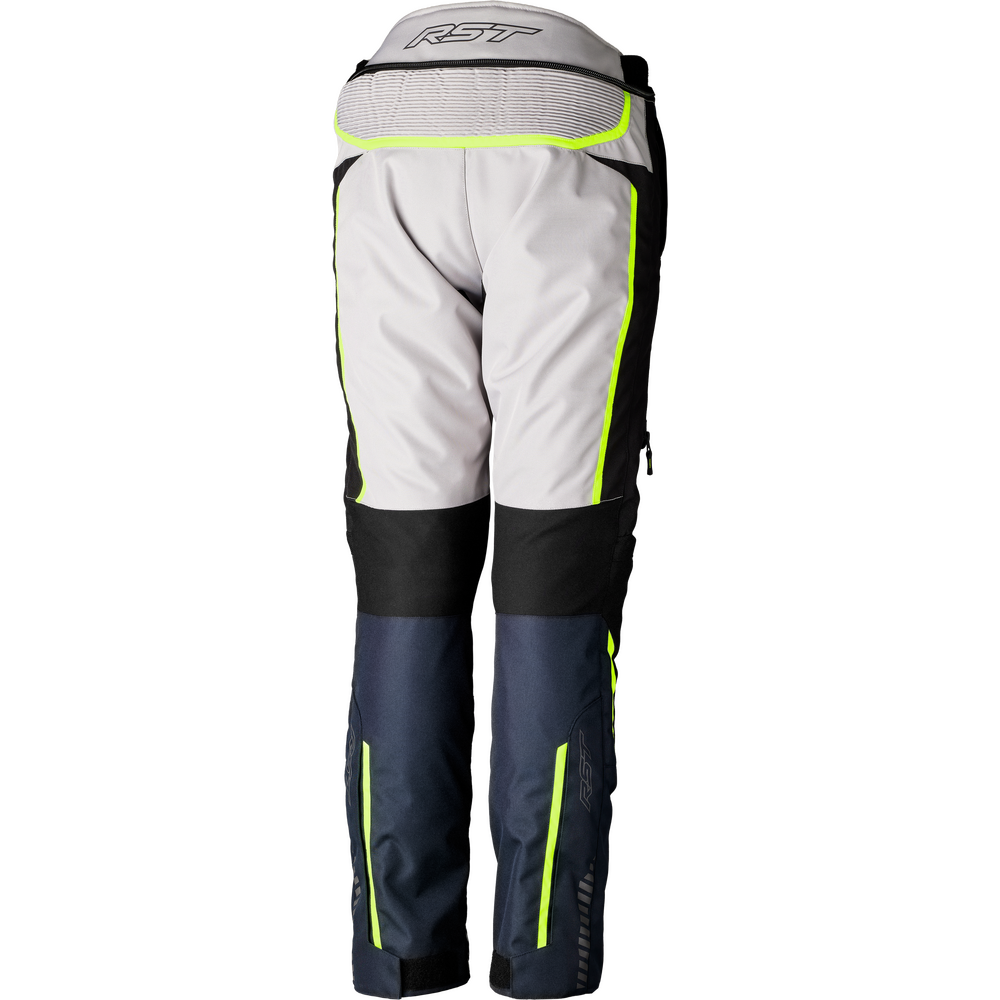 RST motorcycle pants shown from the back, featuring a light gray upper section, black knee panels, navy lower legs, and bright neon yellow-green reflective piping.