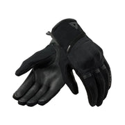 Pair of black gloves on a light gray background