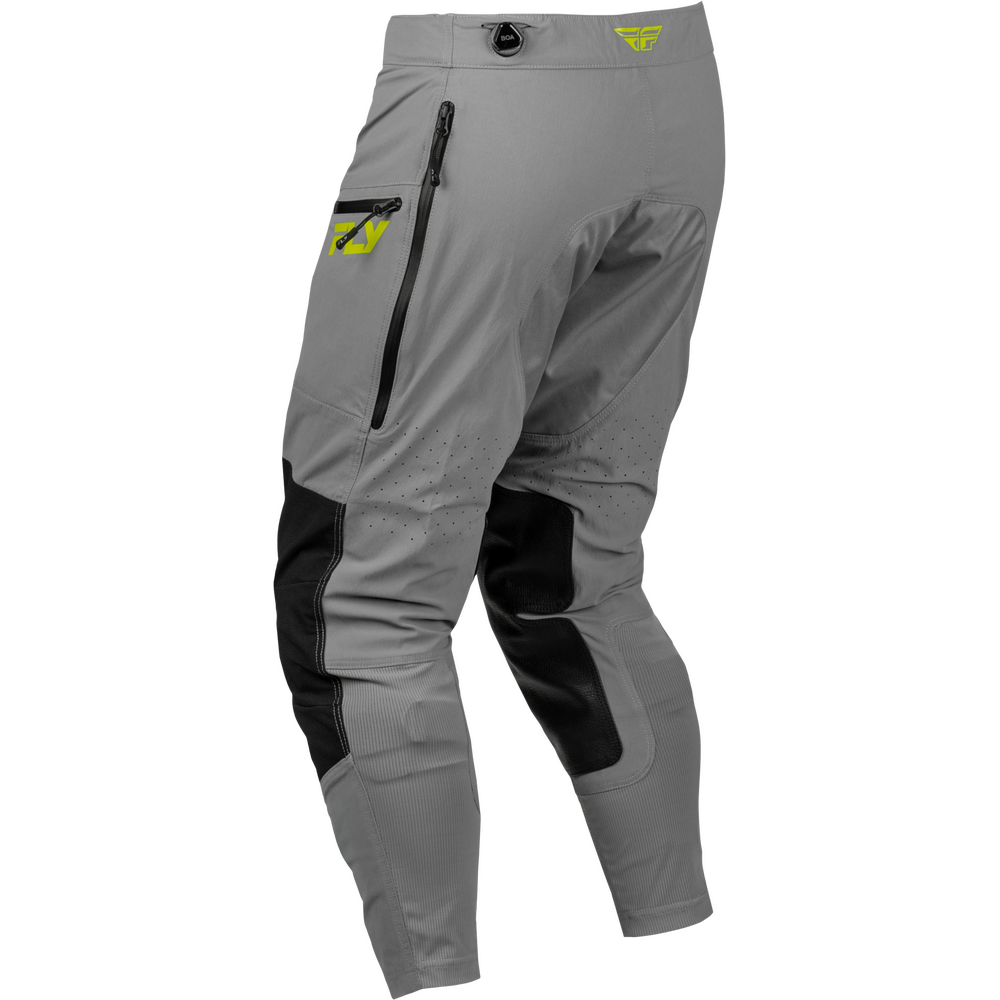 Gray technical riding pants with black knee and side panel accents, a zippered pocket on the upper left thigh, and a small yellow logo on the waistband and pocket.