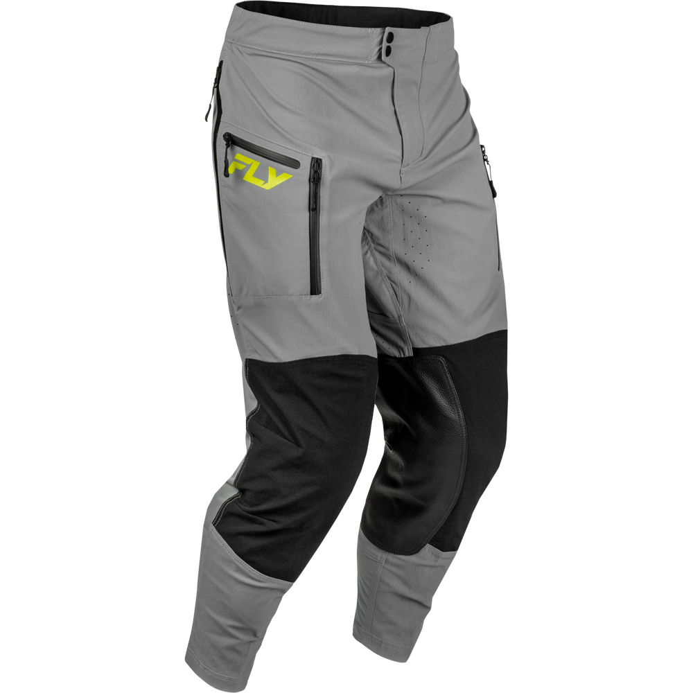 Gray and black motocross pants with a bright yellow 'FLY' logo on the left thigh, shown on a plain white background.