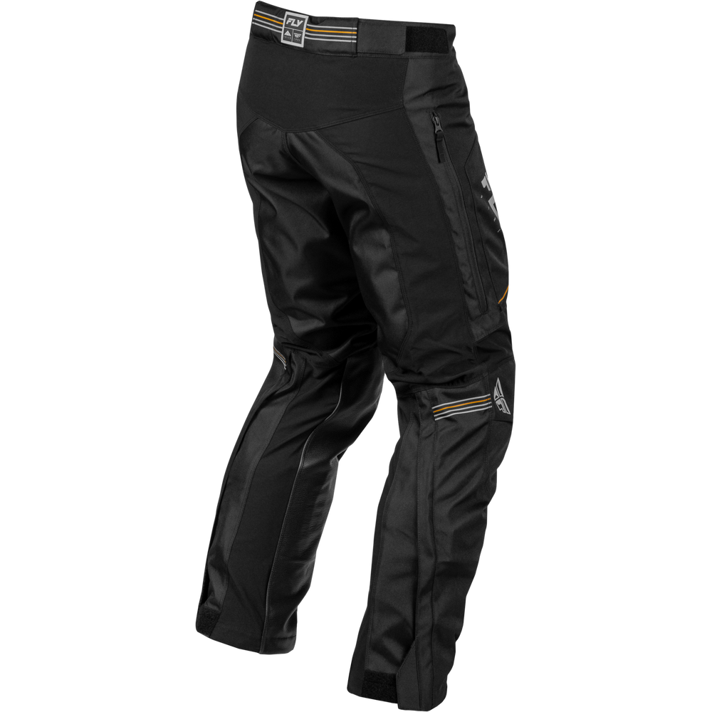 Black technical riding pants with multiple zippered pockets and small orange and white logo details, shown on a plain white background.