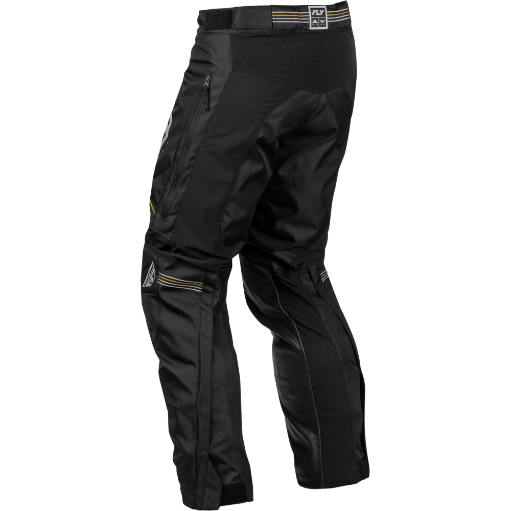 Black technical riding pants with multiple zippered pockets and subtle gold and white logo accents, shown from a three-quarters angle on a white background.