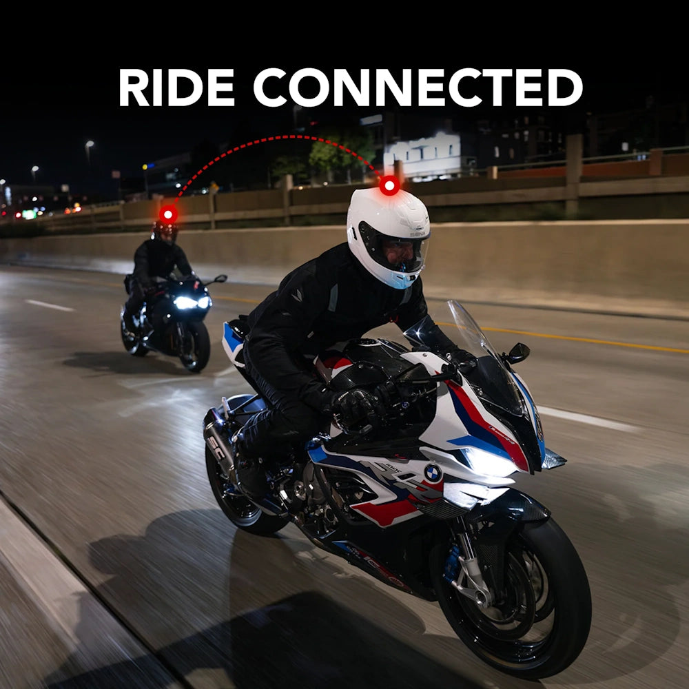 Two motorcyclists on a highway at night with one wearing a helmet light, labeled 'Ride Connected'.