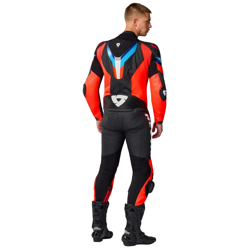 Person wearing a black and red motorcycle suit on a white background