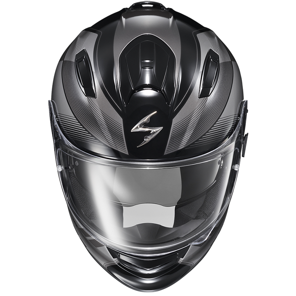 A black full-face motorcycle helmet with a glossy finish, featuring a clear visor and a stylized silver logo on the forehead, shown against a plain white background.