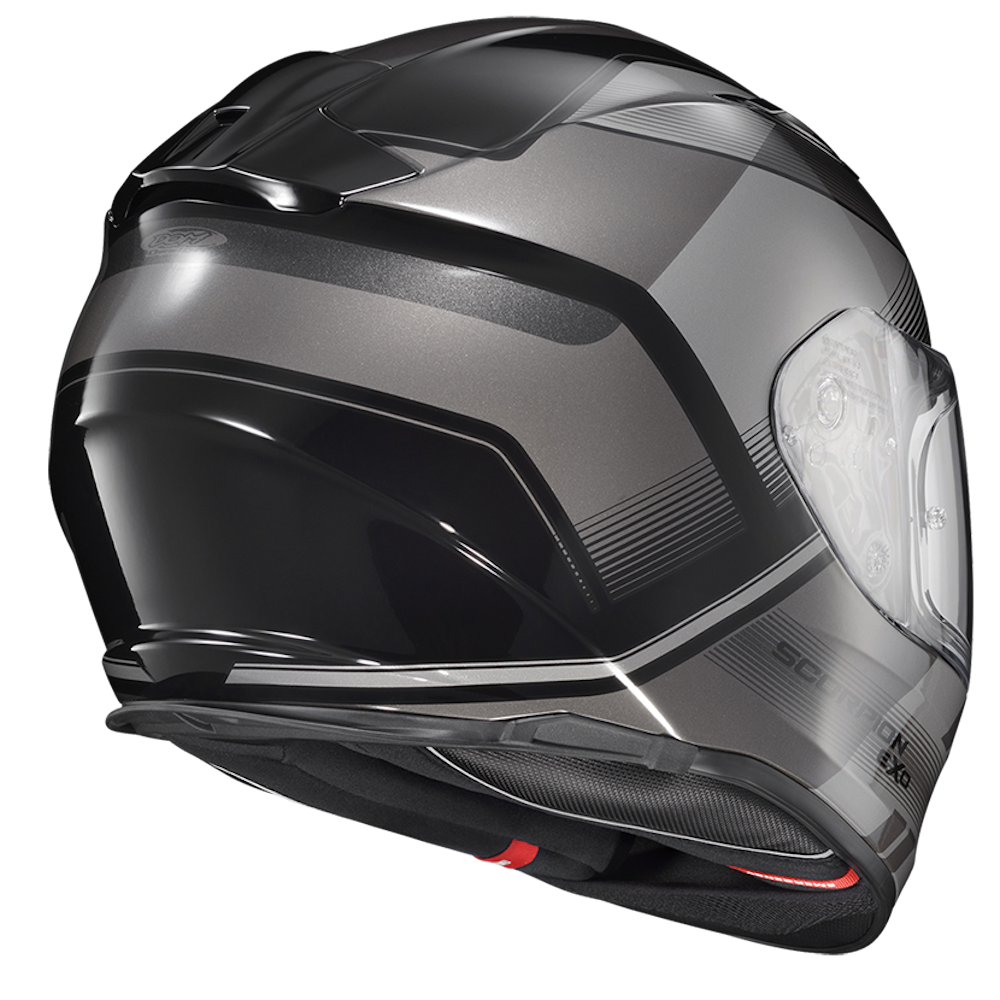 A dark gray and black full-face motorcycle helmet with a clear visor, shown from a three-quarters angle on a white background.