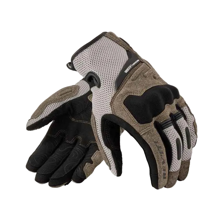 A pair of winter riding gloves in black, gray, and brown, featuring breathable mesh panels and textured grip sections, displayed against a light cream background.