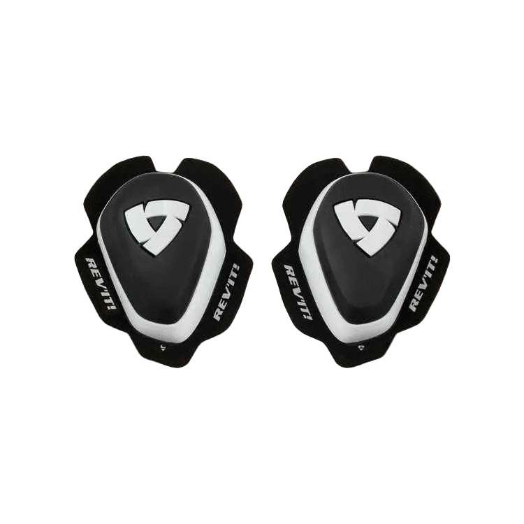 A pair of black and white REV'IT! knee pads shown flat against a light beige background.