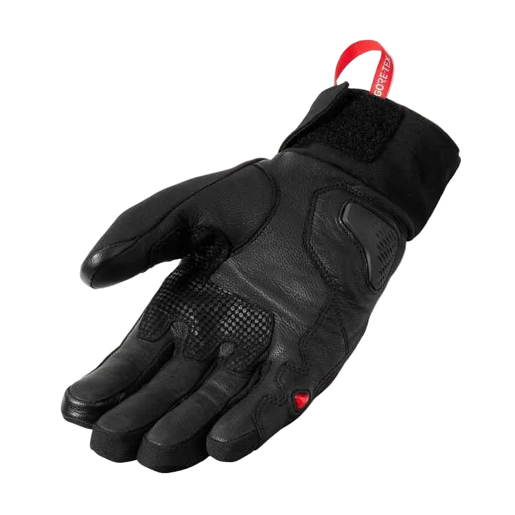 Black motorcycle glove with brand tag on a light gray background