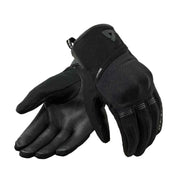 Pair of black gloves on a light gray background