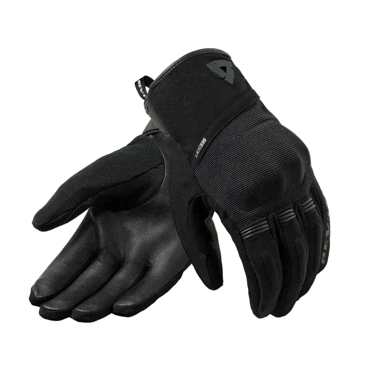 Pair of black gloves on a light gray background