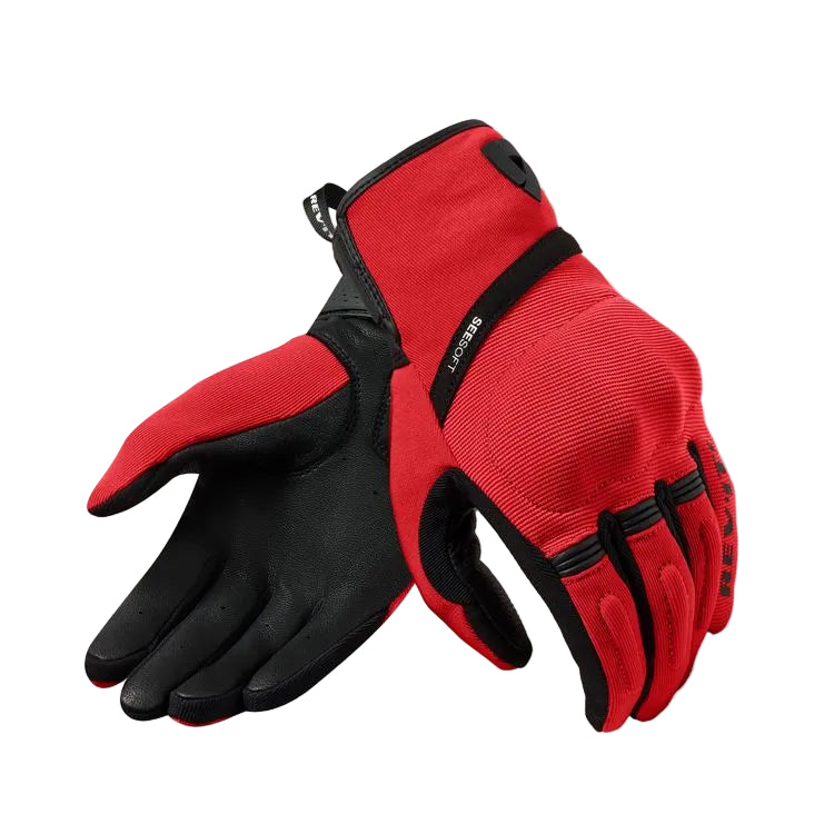 Red and black gloves on a light gray background
