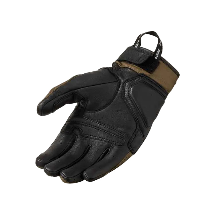 Black and brown glove on a light gray background