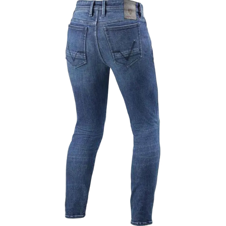 Rear view of a pair of slim-fit blue denim jeans on a light beige background.