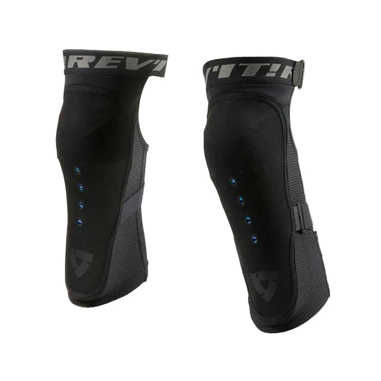 A pair of black Rev'it! knee pads shown from the front and side against a light off-white background.