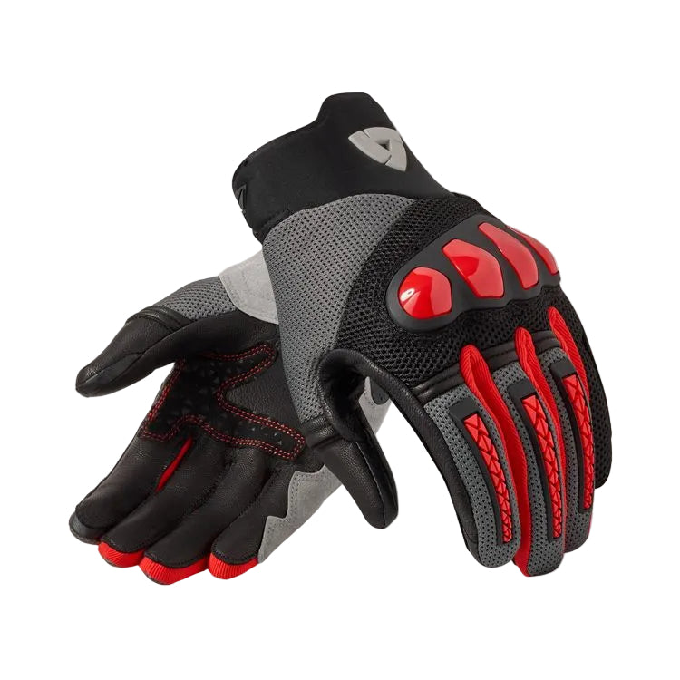Pair of black, gray, and red gloves on a light gray background