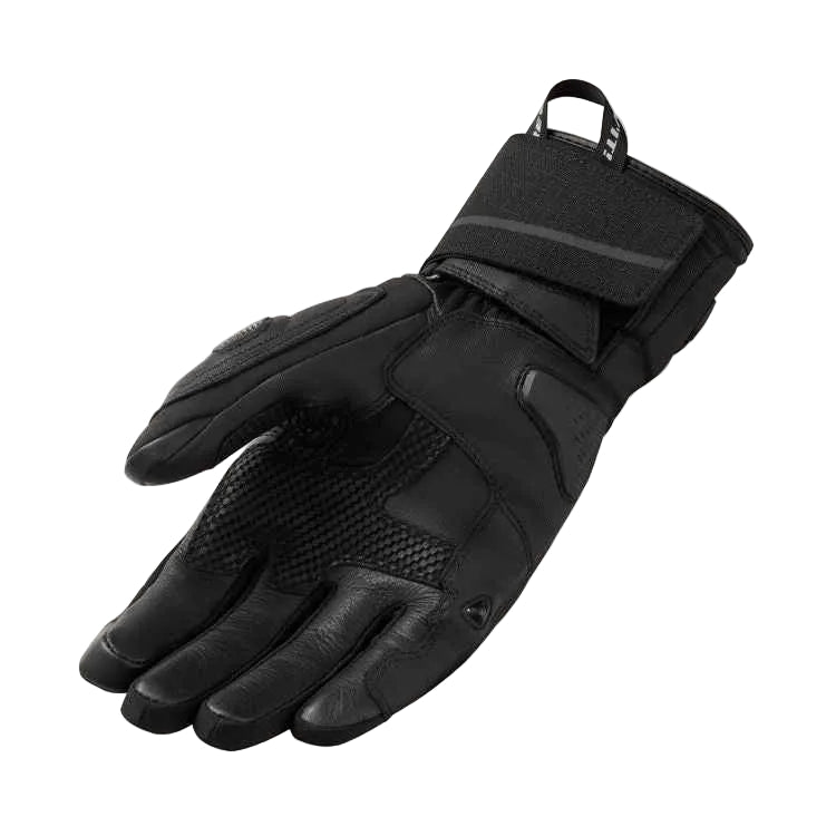 Black glove with textured palm on a light gray background
