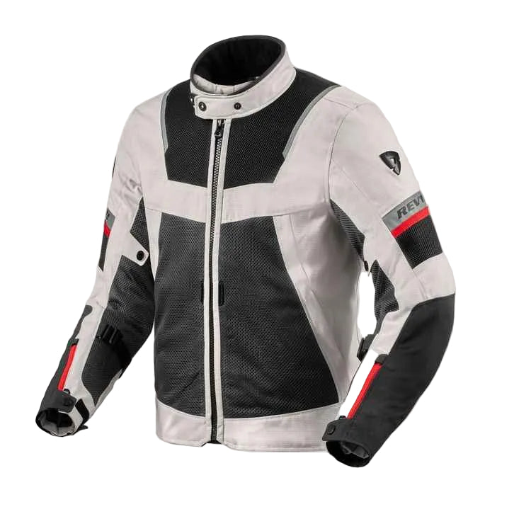 A technical motorcycle jacket in white and black mesh with red accents, featuring a high collar and a visible RAVI logo patch on the upper sleeve.