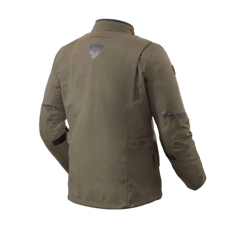 An olive green jacket shown from the back, featuring a small shield-shaped logo on the upper back and dark contrast stitching on the sleeves, set against a light off-white background.