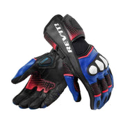A pair of black leather motorcycle gloves with blue and red accents, featuring the brand name 'REV'IT!' in white on the back of one glove, displayed against a light beige background.