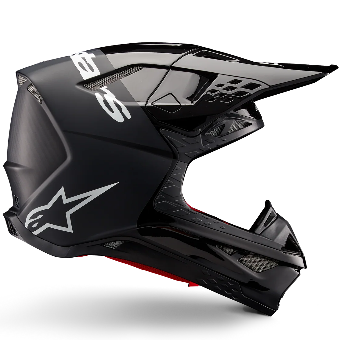 Black motocross helmet with clear visor on a white background