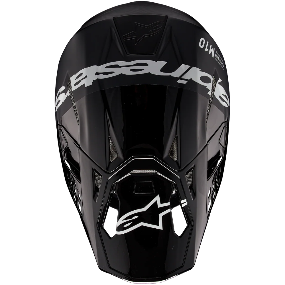 A glossy black Alpinestars full-face motocross helmet shown from the front against a solid white background.