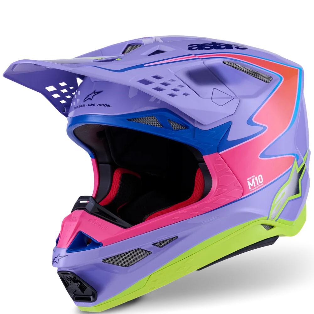 A motocross full-face helmet in a vibrant purple colorway with blue, pink, orange, and lime green accents, shown from a three-quarters angle on a white background.