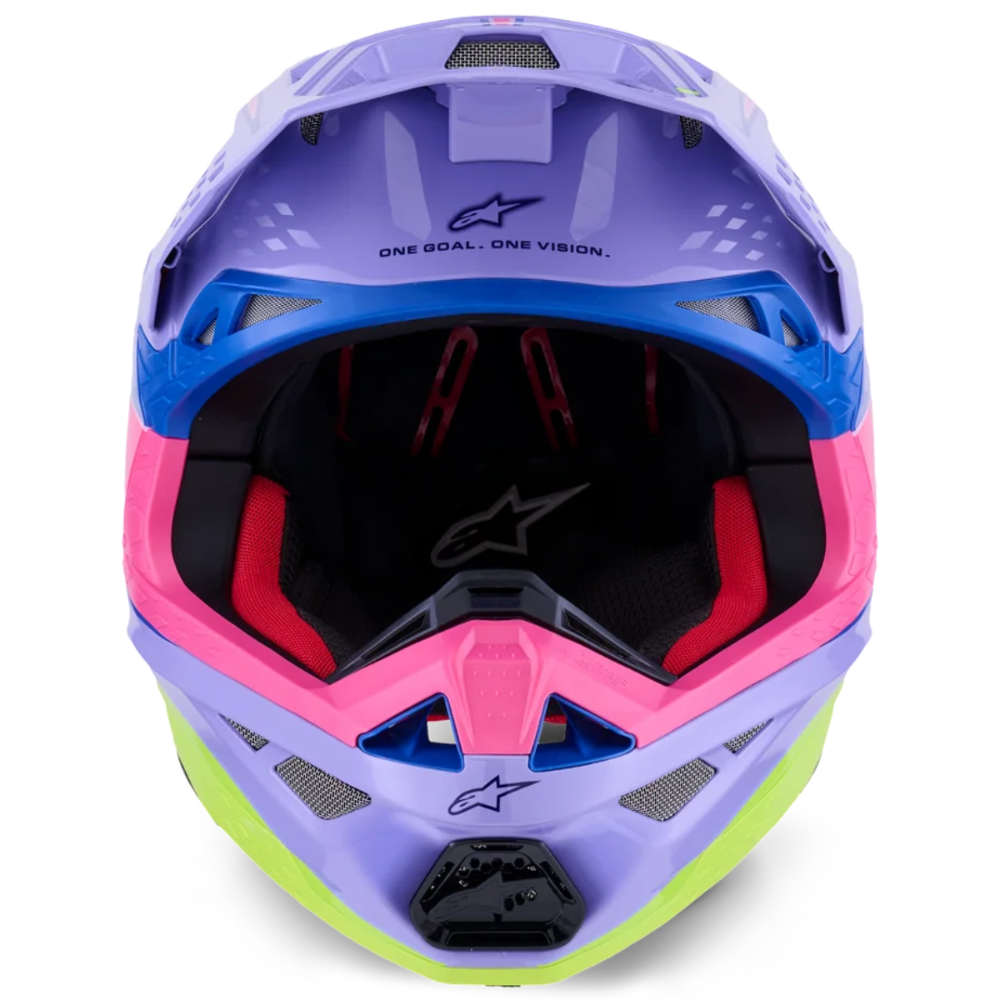 A motocross helmet in a vibrant pastel color scheme of lavender purple, hot pink, sky blue, and lime green, shown from a front-facing perspective on a solid white background.