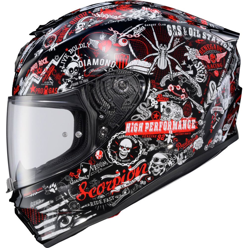 A full-face motorcycle helmet with a black base and a detailed red, white, and gray graphic print featuring skulls, spiders, and various biker-style logos and text.