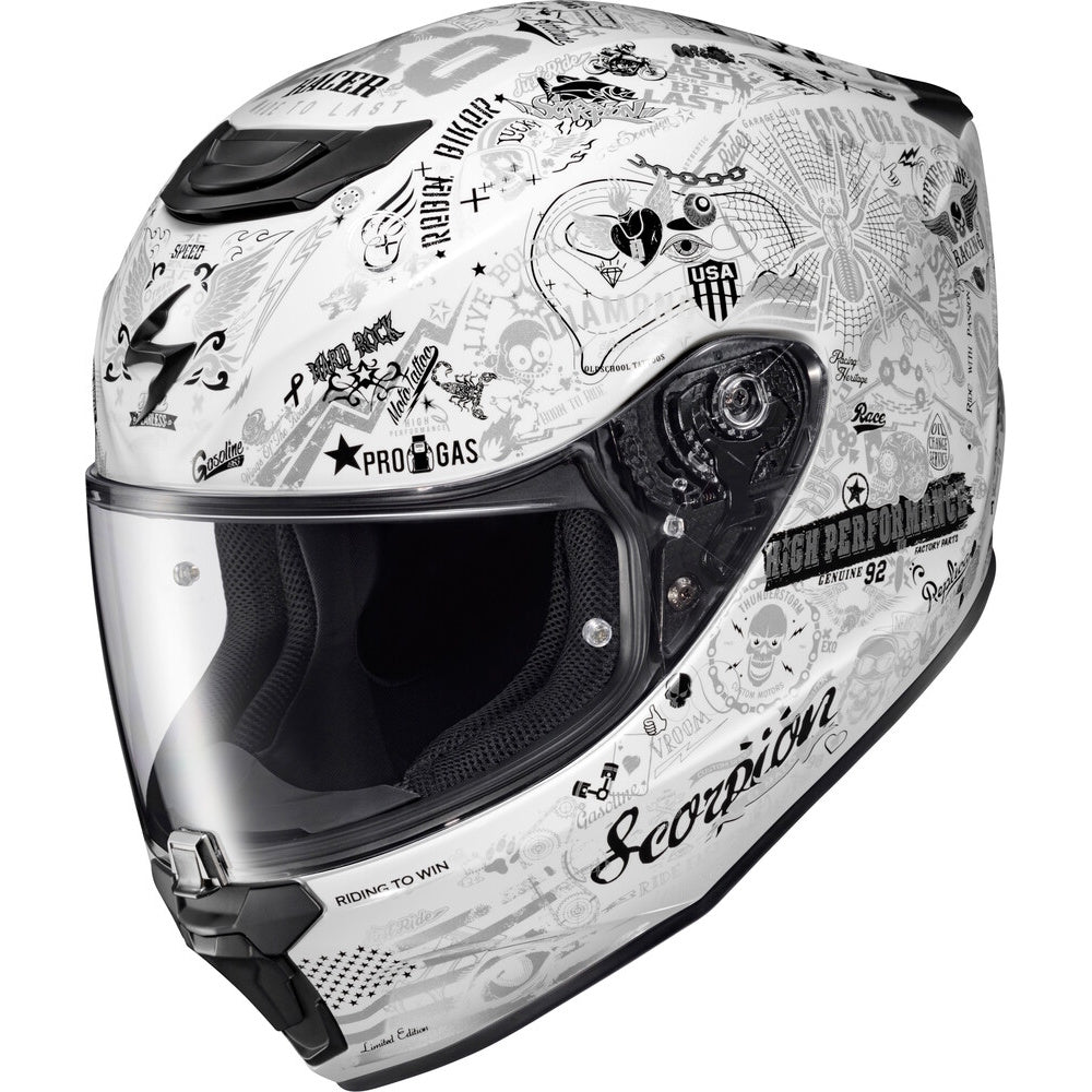 A Scorpion full-face motorcycle helmet in white with black graphic illustrations, including skulls, stars, and the Scorpion logo, shown against a plain white background.