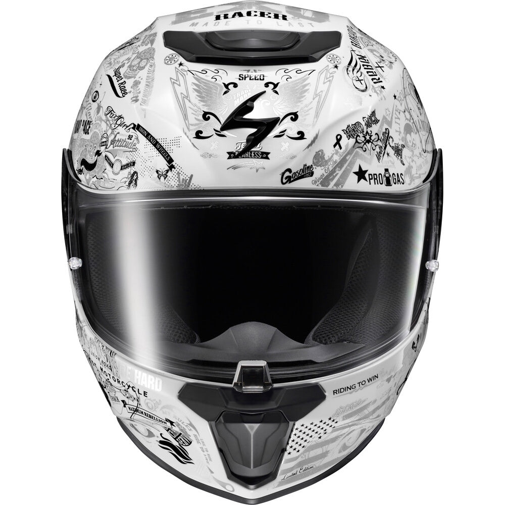 A full-face motorcycle helmet with a white base and black graphic decals, featuring a dark visor, photographed against a solid white background.