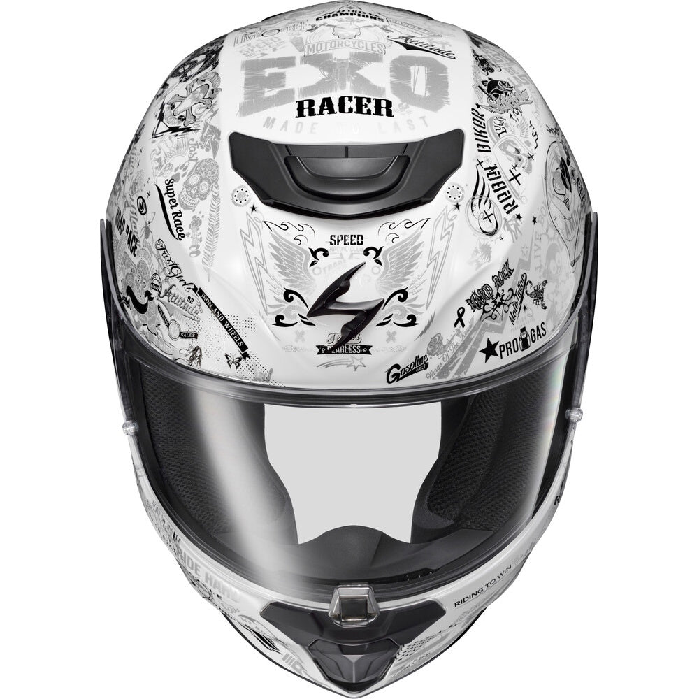 A white full-face motorcycle helmet with black and gray graphic decals, featuring the text 'EXO RACER' on the forehead and a clear visor, shown against a plain white background.