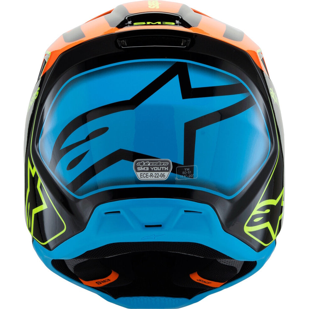 Alpinestars Youth MX1 2024 full-face motocross helmet in vibrant blue, black, and orange with neon yellow-green accents, featuring the Alpinestars star logo on the visor.