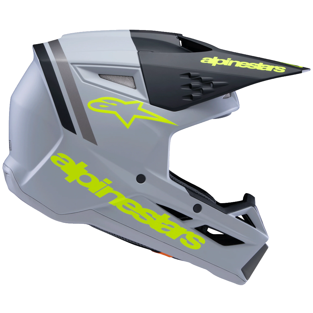 Alpinestars full-face motocross helmet in gray and black with neon yellow-green logo accents, shown from a side profile on a white background.