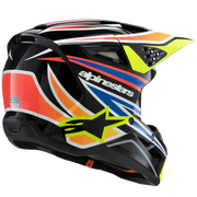 Alpinestars full-face motocross helmet in black with vibrant orange, yellow, blue, and white graphic accents, shown from a side profile against a solid black background.