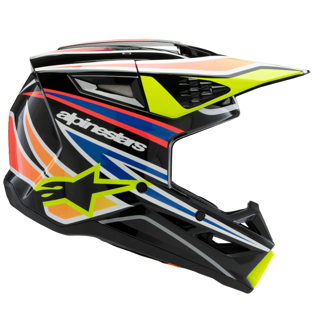 Alpinestars motocross helmet in black with vibrant neon yellow, orange, blue, and white graphic accents, shown from a side profile on a white background.