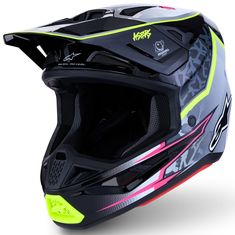 A full-face motocross helmet in black and gray with vibrant neon lime green, hot pink, and white graphic accents, shown from a three-quarters angle on a white background.