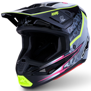 A full-face motocross helmet in black and gray with vibrant neon lime green, hot pink, and white graphic accents, shown from a three-quarters angle on a white background.