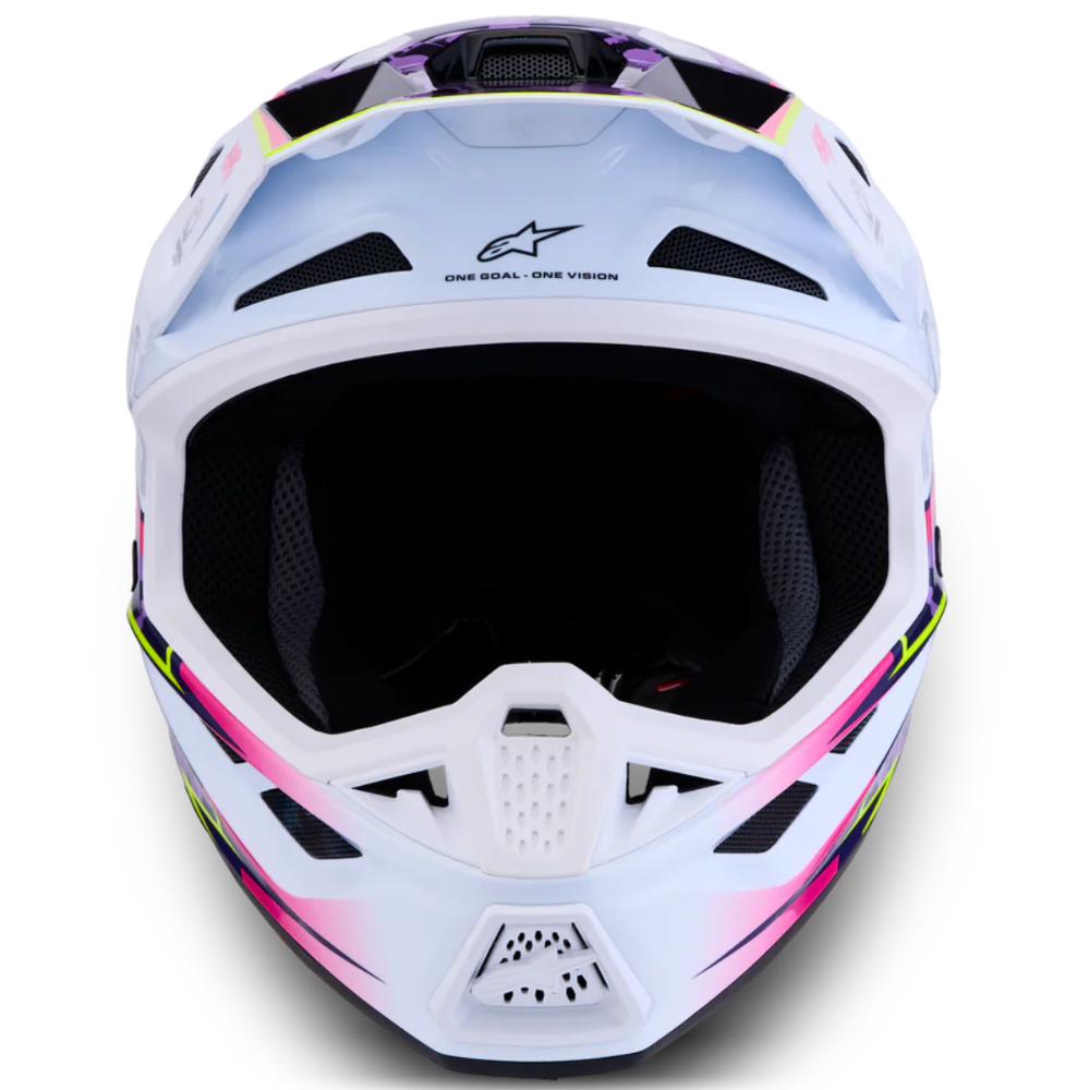 A front-facing Alpinestars full-face motocross helmet in white with vibrant pink, purple, and green graphic accents, set against a plain white background.