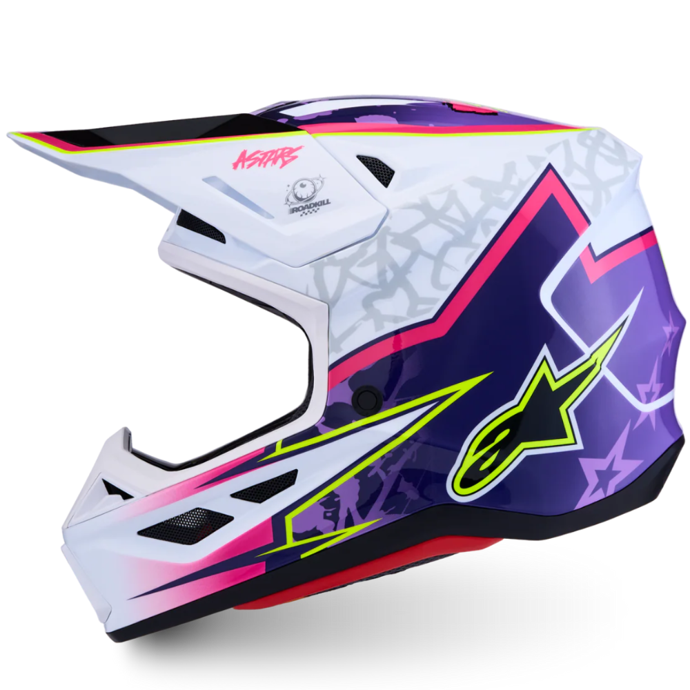 A motocross full-face helmet by Alpinestars in a white, purple, and pink colorway with neon yellow-green and black graphic accents, shown from a three-quarters angle on a white background.
