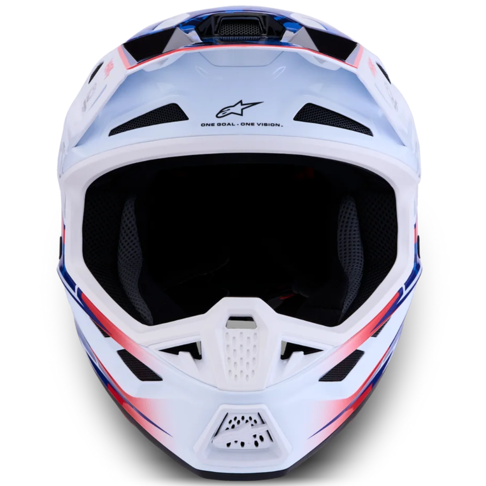 A white Alpinestars full-face motocross helmet with a dark visor, featuring red and blue graphic accents on the sides, photographed against a solid white background.