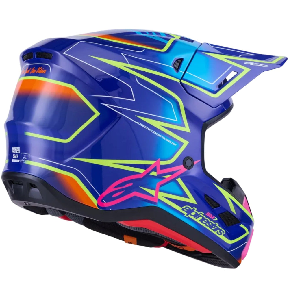 Alpinestars SMX motocross helmet in a vibrant blue colorway with neon lime green, pink, and orange graphic accents, shown from a three-quarters angle on a white background.