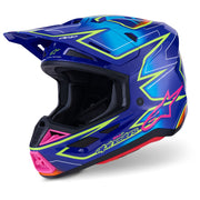 Alpinestars full-face motocross helmet in a vibrant blue colorway with neon lime green, hot pink, and orange graphic accents, shown from a three-quarters angle on a white background.
